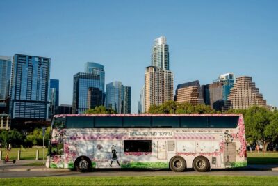 Tea Around Town Austin: Elegant Tea Bus Tour and Treats - Getting on the Vintage Double-Decker at 650 E 10th St